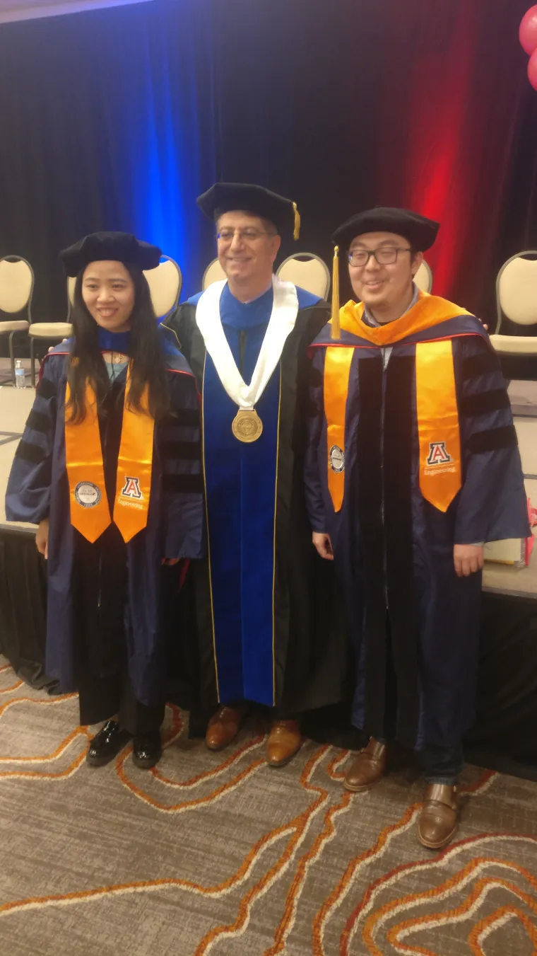 Graduation pic of Wenhan, Zhengguang with Dr. Krunz